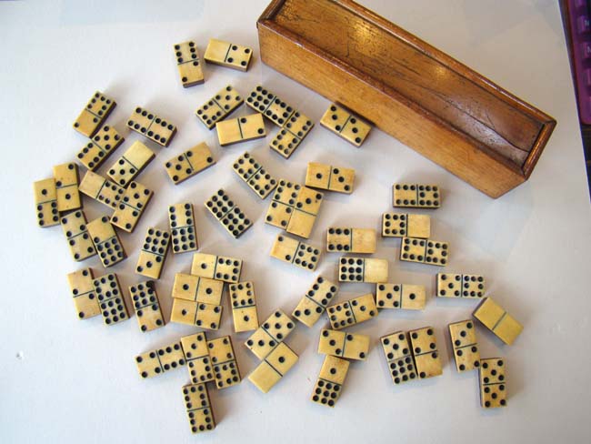 A fine antique set ( 55 pieces) of 'double nines' bone and walnut dominoes circa 1850